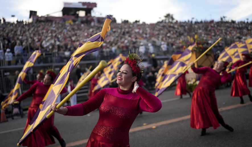 The West Chester University Golden Rams marching band performs at the 135th Rose Parade in Pasadena, Calif., Monday, Jan. 1, 2024. (AP Photo/Jae C. Hong)