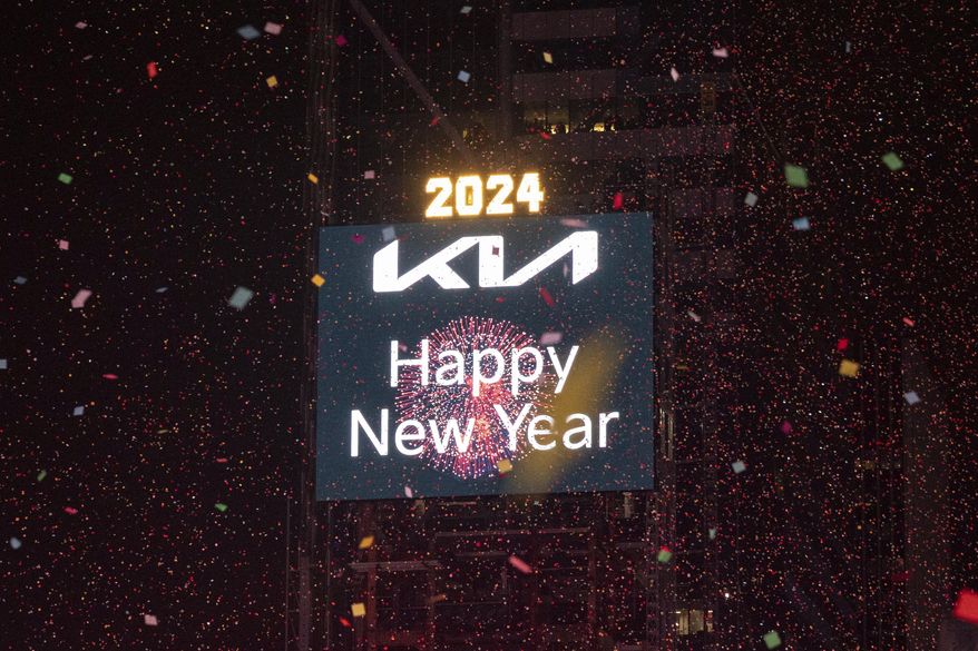 Confetti drops over the crowd as the clock strikes midnight as seen from the New York Marriott Marquis during the New Year's Eve celebration in Times Square, early Monday, Jan. 1, 2024, in New York. (AP Photo/Yuki Iwamura)