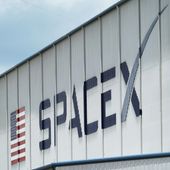 The SpaceX logo is displayed on a building, May 26, 2020, at the Kennedy Space Center in Cape Canaveral, Fla. On Wednesday, Jan. 3, 2024, a U.S. labor agency accused SpaceX of unlawfully firing employees who penned an open letter critical of CEO Elon Musk and creating an impression that worker activities were under surveillance by the rocket ship company. (AP Photo/David J. Phillip, File)