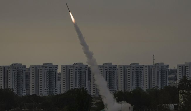 Israel&#x27;s Iron Dome anti-missile system fires to intercept a rocket launched from the Gaza Strip towards Israel, near Ashkelon, Israel, Thursday, May 11, 2023. The Israel Defense Forces used a locally produced air-to-surface missile dubbed the Rampage in its strike last week on an airfield near the city of Isfahan in central Iran, according to media in Israel. (AP Photo/Ariel Schalit, File)