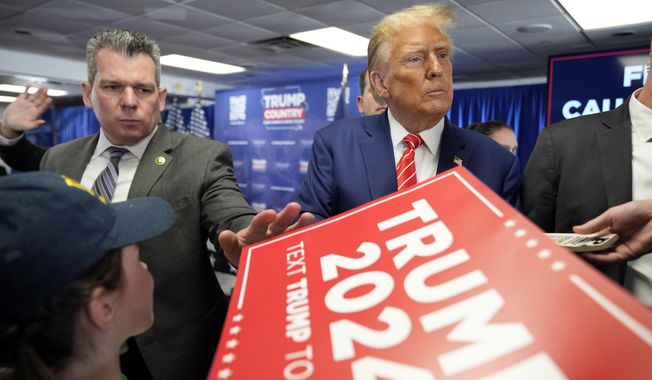 Republican presidential candidate former President Donald Trump signs autographs after speaking at a rally at Des Moines Area Community College in Newton, Iowa, Saturday, Jan. 6, 2024. (AP Photo/Andrew Harnik) **FILE**