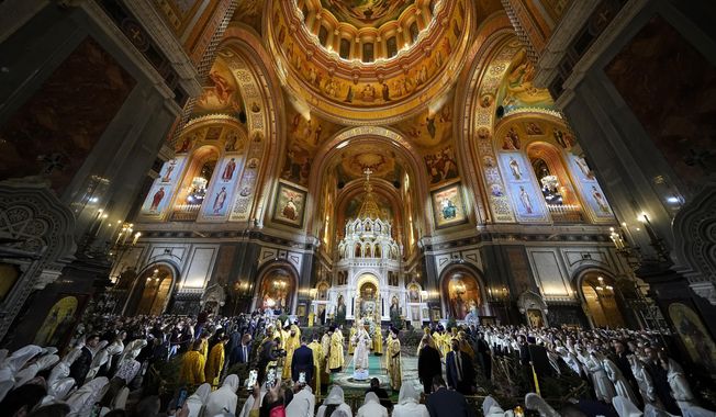 Russian Orthodox Patriarch Kirill, center, delivers the Christmas service in the Christ the Saviour Cathedral in Moscow, Russia, Friday, Jan. 6, 2023. While much of the world has Christmas in the rearview mirror by now, people in some Eastern Orthodox traditions will celebrating the holy day on Sunday. Jan. 7, 2024. (AP Photo/Alexander Zemlianichenko, Pool, File)