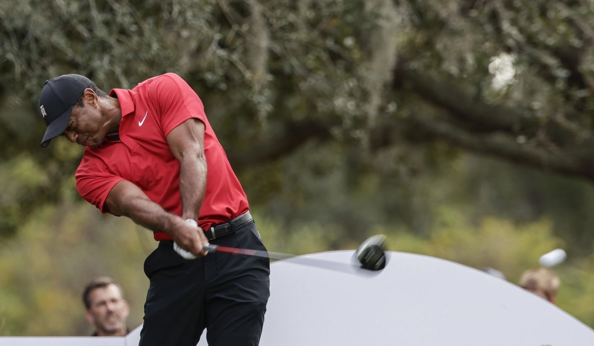 NextImg:Woods reveals Sun Day Red through TaylorMade is his new apparel
