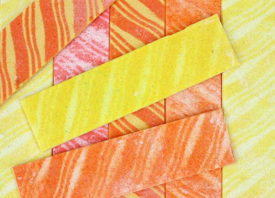Several strips of colorful striped fruit-flavored gum. File photo credit: BW Folsom.