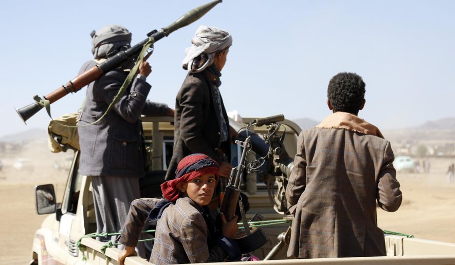 Houthi fighters and tribesmen stage a rally against the U.S. and the U.K. strikes on Houthi-run military sites near Sanaa, Yemen, on Sunday, Jan. 14, 2024. (AP Photo)