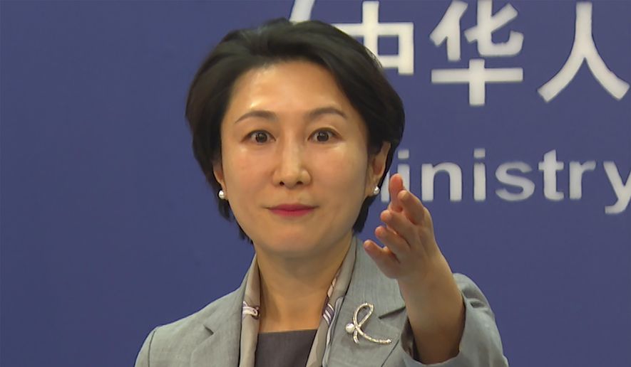 In this image made from video, Chinese Foreign Ministry spokesperson Mao Ning gestures during a press conference in Beijing, China, on Tuesday, Jan. 16, 2024. (AP Photo/Liu Zheng) ** FILE **