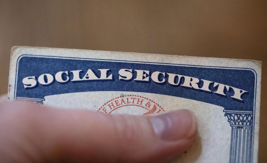 A Social Security card is displayed on Oct. 12, 2021, in Tigard, Ore. A growing number of older adults are in debt in retirement, according to the 2022 Survey of Consumer Finances from the Federal Reserve. Supplementing retirement savings and Social Security benefits with part-time earnings can make your money go further and help you pay off remaining debt. (AP Photo/Jenny Kane, File)