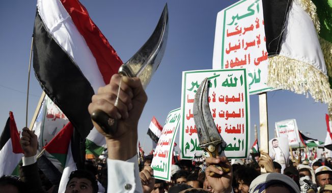 Houthi supporters attend a protest against the United States-led airstrikes on Friday, Jan 12, 2024, in Sanaa, Yemen. The U.S. and British militaries bombed more than a dozen sites used by the Iranian-backed Houthis. The military targets included air defense and radar sites, drone and missile storage and launching locations. (AP Photo) ** FILE **