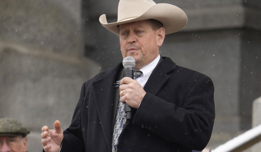 FILE - Mike Lynch, Colorado House of Representatives minority leader, R-Wellington, addresses attendees during a rally, April 4, 2023, outside the state Capitol in downtown Denver. On Wednesday, Jan. 24, 2024, Lynch announced that he's stepping down as minority leader, a week after The Denver Post reported that he was arrested in 2022 on suspicion of drunken driving and possession of a gun while intoxicated. (AP Photo/David Zalubowski, File)