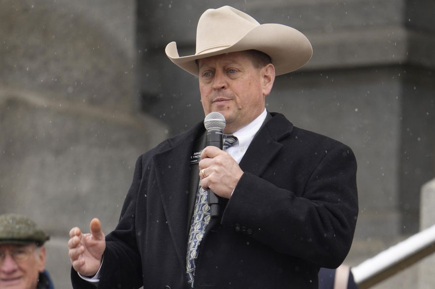 FILE - Mike Lynch, Colorado House of Representatives minority leader, R-Wellington, addresses attendees during a rally, April 4, 2023, outside the state Capitol in downtown Denver. On Wednesday, Jan. 24, 2024, Lynch announced that he's stepping down as minority leader, a week after The Denver Post reported that he was arrested in 2022 on suspicion of drunken driving and possession of a gun while intoxicated. (AP Photo/David Zalubowski, File)