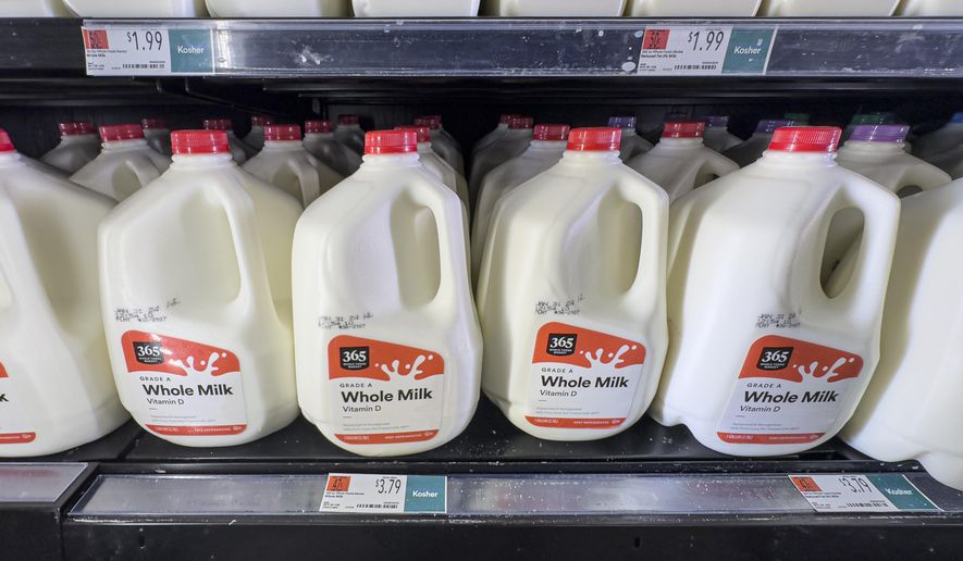 Whole milk is displayed for sale at a Whole Foods grocery store, Friday, Jan. 19, 2024, in New York. A typical basket of groceries now costs 20% more than in February 2021, just before inflation began to take off. (AP Photo/Peter K. Afriyie)