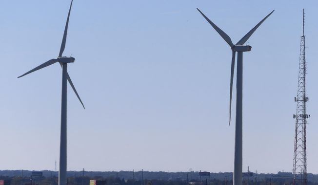 Land-based wind turbines spin in Atlantic City, N.J. on Nov. 3, 2023. On Jan. 24, 2024, New Jersey utilities regulators approved two additional offshore wind farms, bringing the state&#x27;s number to three. (AP Photo/Wayne Parry)