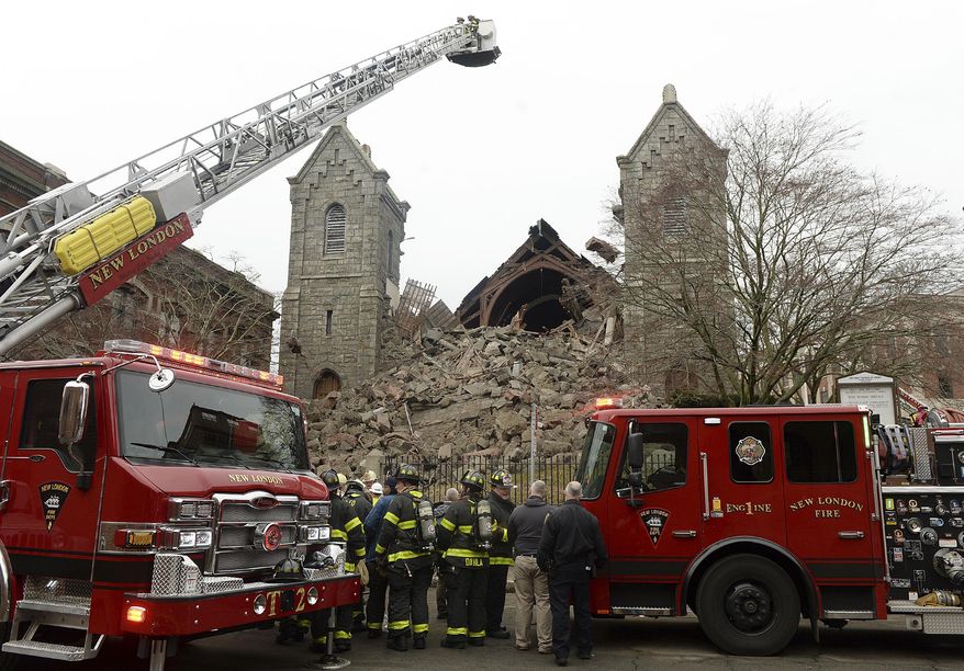 Emergency crews respond to the former First Congregational church after the steeple of the old, historic church collapsed, Thursday, Jan. 25, 2024, in New London, Conn. (Dana Jensen/The Day via AP)