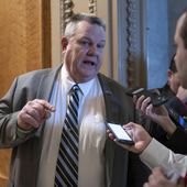 Sen. Jon Tester, D-Mont., speaks with reporters about the border security talks, outside the chamber at the Capitol in Washington, Thursday, Jan. 25, 2024. Republican Senate candidates in battleground races are armed with fresh ammunition against incumbent Democrats, vowing not to let voters forget who kept Homeland Security Secretary Alejandro Mayorkas in office. (AP Photo/J. Scott Applewhite)