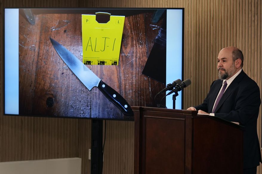 New Hampshire Senior Assistant Attorney General Ben Agati shows an evidence photograph of a large knife, while sharing findings of a deadly force shooting by Guilford, N.H. police on Jan. 1, 2023, during a news conference at the New Hampshire Department of Justice building, Thursday, Jan. 25, 2024, in Concord, N.H. According to a report released, police use of deadly force to shoot a teenager with mental health issues at his home after he approached officers carrying a knife was justified, New Hampshire's attorney general said Thursday. (AP Photo/Charles Krupa)