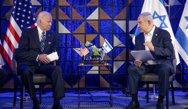 U.S. President Joe Biden, left, meets with Israeli Prime Minister Benjamin Netanyahu, right, to discuss the the war between Israel and Hamas, in Tel Aviv, Israel, on Oct. 18, 2023. U.S. and Mideast mediators appeared optimistic in recent days that they are closing in on a deal for a two-month cease-fire in Gaza and the release of over 100 hostages held by Hamas. But on Tuesday, Israeli Prime Minister Netanyahu rejected the militant group&#x27;s two main demands — that Israel withdraw its forces from Gaza and release thousands of Palestinian prisoners — indicating that the gap between the two sides remains wide. (Miriam Alster/Pool Photo via AP) **FILE**