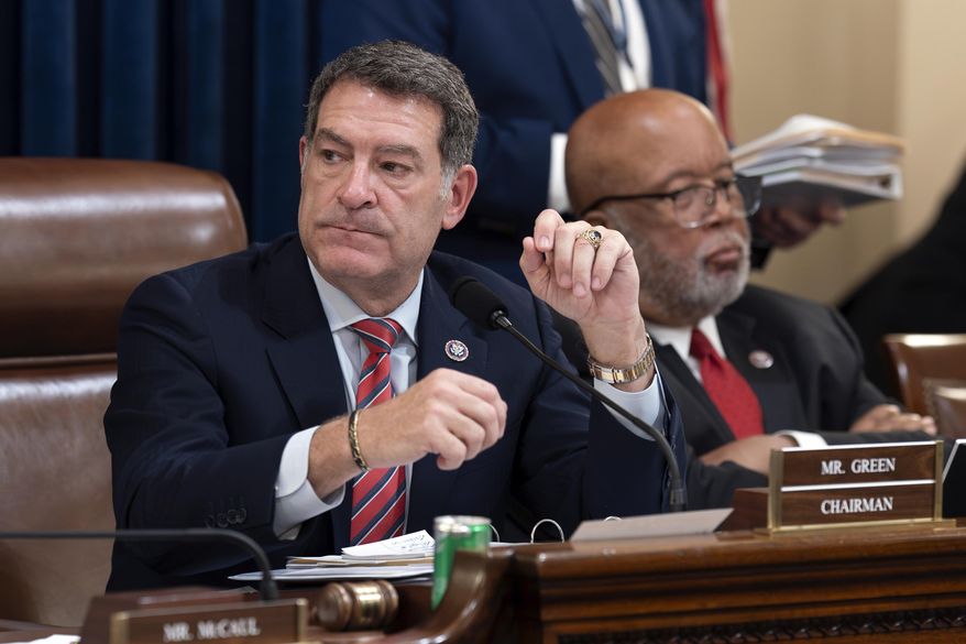 Chairman Mark Green, R-Tenn., center, joined by Rep. Bennie Thompson, D-Miss., the ranking member, leads the House Homeland Security Committee move to impeach Secretary of Homeland Security Alejandro Mayorkas over the crisis at the U.S.-Mexico border, at the Capitol in Washington, Tuesday, Jan. 30, 2024. (AP Photo/J. Scott Applewhite)