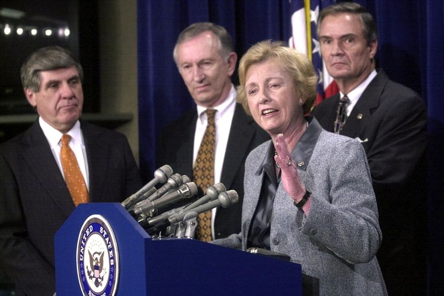 Sen. Jean Carnahan, D-Mo., second right, gestures during a Capitol Hill news conference Wednesday, April 4, 2001 to discuss the budget. From left are, Sen. Ben Nelson, D-Neb., Sen. James Jeffords, R-Vt., Carnahan and Sen. John Breaux, D-La. Carnahan, who became the first female senator to represent Missouri after she was appointed to replace her husband following his death, died Tuesday, Jan. 30, 2024. She was 90. (AP Photo/Stephen J. Boitano, File)