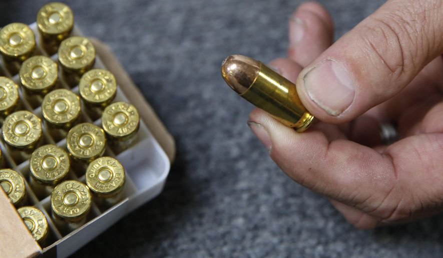 Chris Puehse, owner of Foothill Ammo, displays .45-caliber ammunition for sale at his store in Shingle Springs, Calif., on June 11, 2019. A Turks and Caicos judge allowed a U.S. citizen to avoid jail time Friday after the American was facing 12 years in prison for having loose bullets (not pictured) mixed in with his vacation luggage. (AP Photo/Rich Pedroncelli) **FILE**