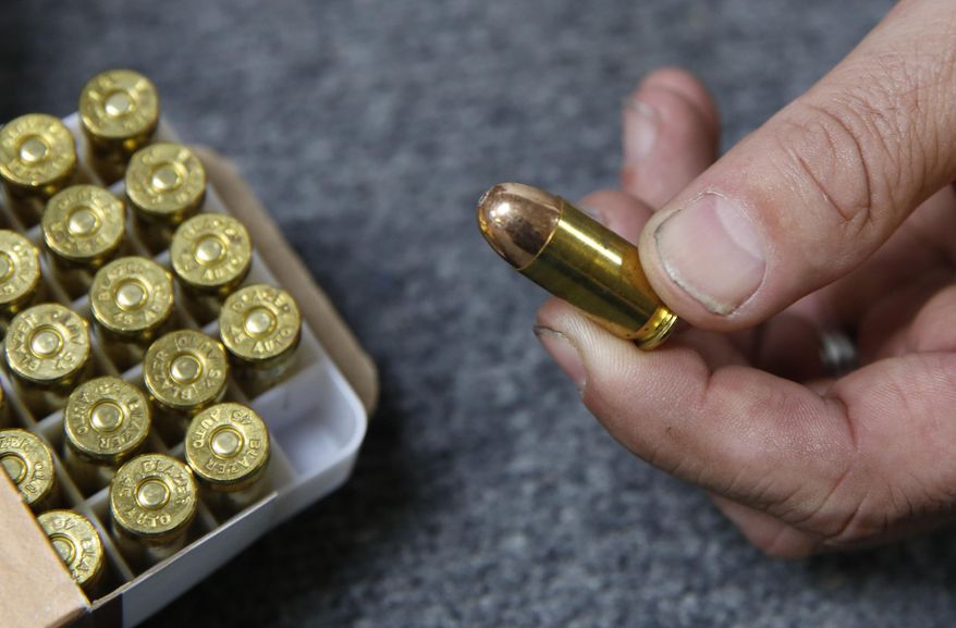 Chris Puehse, owner of Foothill Ammo, displays .45-caliber ammunition for sale at his store in Shingle Springs, Calif., on June 11, 2019. A Turks and Caicos judge allowed a U.S. citizen to avoid jail time Friday after the American was facing 12 years in prison for having loose bullets (not pictured) mixed in with his vacation luggage. (AP Photo/Rich Pedroncelli) **FILE**
