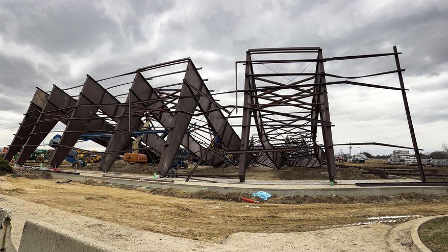 Twisted girders and debris cover the ground from a deadly structure collapse at a construction site near the Boise Airport on Thursday, Feb. 1, 2024 in Boise, Idaho. Authorities responded Wednesday to the privately owned steel-framed hangar, which suffered a “catastrophic” collapse, Boise Fire Department Operations Chief Aaron Hummel said during an earlier news briefing. (Darin Oswald /Idaho Statesman via AP)