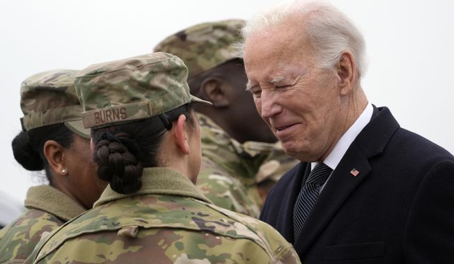 President Joe Biden greets service members after arriving at Dover Air Force Base, Del., Friday, Feb. 2, 2024. (AP Photo/Alex Brandon)