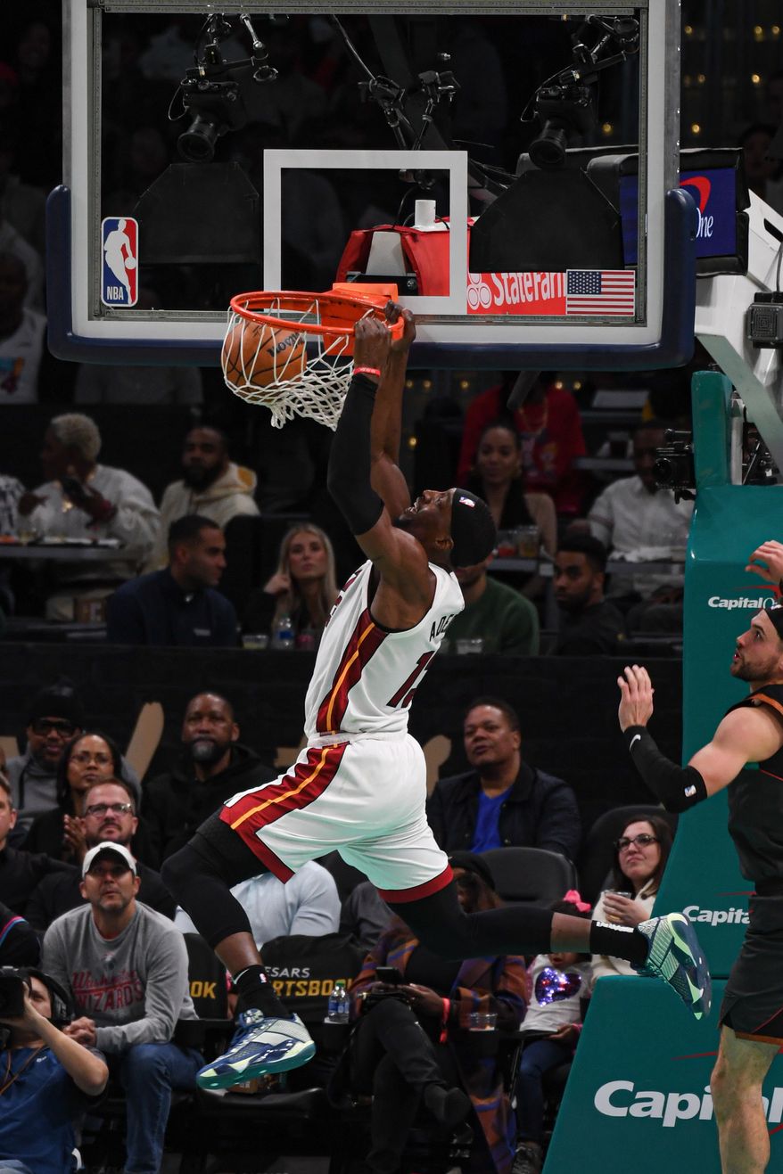 Miami Heat center Bam Adebayo (13) slamming the ball down during the second quarter of an NBA game against the Washington Wizards at Capital One Arena in Washington D.C., February 2, 2024. (Photo by Billy Sabatini)