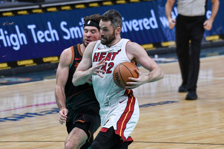 Miami Heat forward Kevin Love (42) taking the ball to the hoop during the third quarter of an NBA game against the Washington Wizards at Capital One Arena in Washington D.C., February 2, 2024. (Photo by Billy Sabatini)