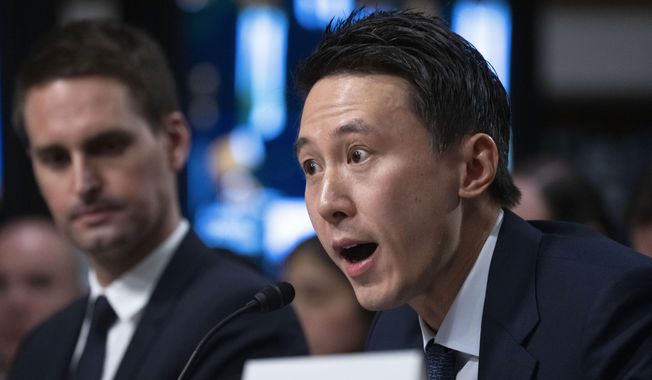 TikTok CEO Shou Zi Chew, testifies during a Senate Judiciary Committee hearing on Capitol Hill in Washington, Wednesday, Jan. 31, 2024, on child safety. Snap CEO Evan Spiegel, left, listens.(AP Photo/Manuel Balce Ceneta)