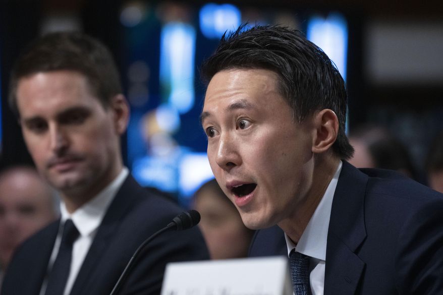 TikTok CEO Shou Zi Chew, testifies during a Senate Judiciary Committee hearing on Capitol Hill in Washington, Wednesday, Jan. 31, 2024, on child safety. Snap CEO Evan Spiegel, left, listens.(AP Photo/Manuel Balce Ceneta)