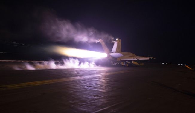 This image provided by the U.S. Navy shows an aircraft launching from USS Dwight D. Eisenhower (CVN 69) during flight operations in the Red Sea, Jan. 22, 2024. The United States and Britain struck 36 Houthi sites in Yemen on Saturday, Feb. 3, in a second wave of assaults meant to further disable Iran-backed groups in the region. (Kaitlin Watt/U.S. Navy via AP)