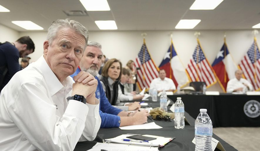 Idaho Gov. Brad Little listens at a press conference about border policies in Eagle Pass, Texas on Sunday, Feb. 4, 2024. (Jay Janner/Austin American-Statesman via AP)