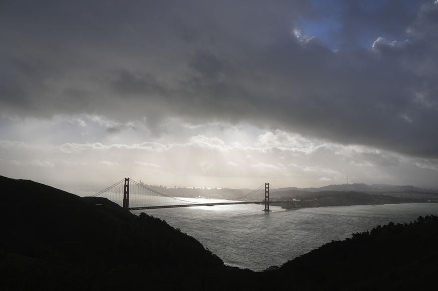 A storm passes above the Golden Gate Bridge near Sausalito, Calif., Monday, Feb. 5, 2024. In Northern California, the storm inundated streets and brought down trees and electrical lines Sunday throughout the San Francisco Bay Area, where winds topped 60 mph (96 kph) in some areas. (AP Photo/Eric Risberg) ** FILE **