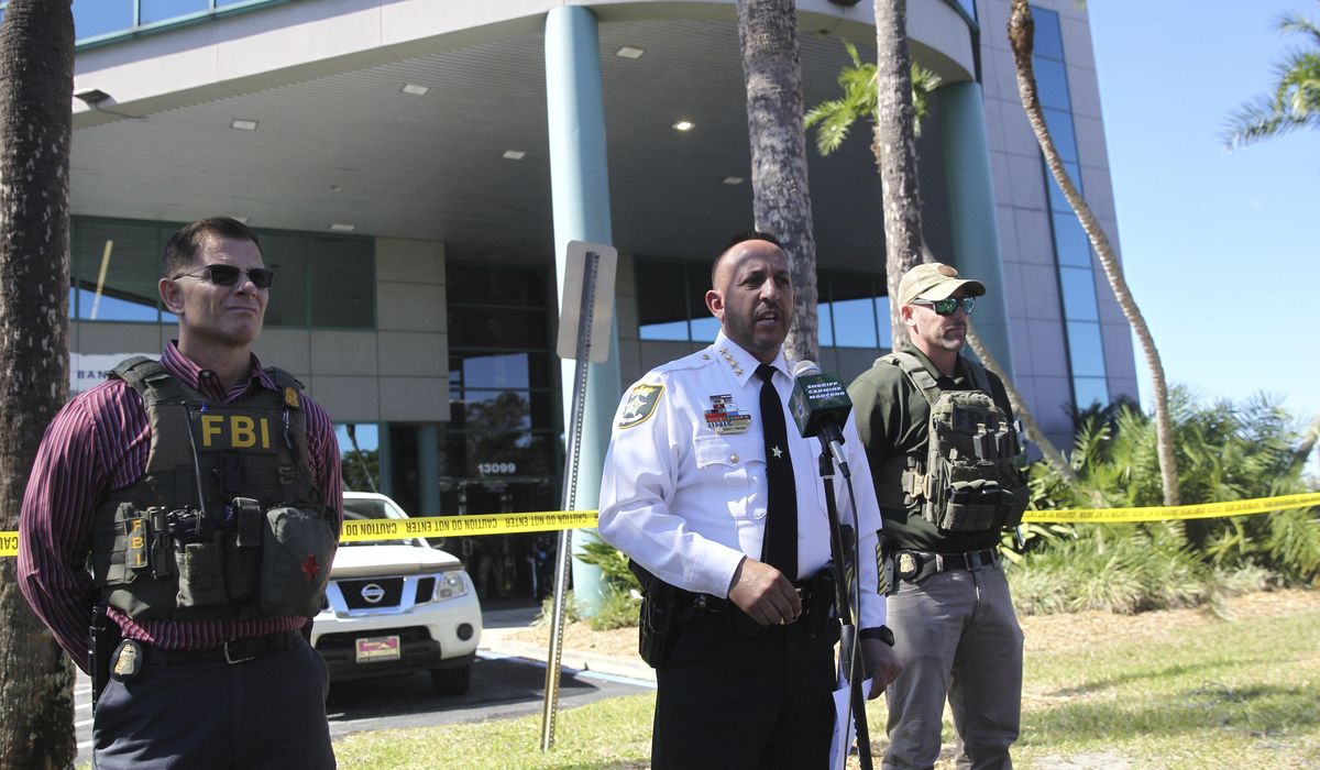 NextImg:A SWAT team sniper killed a bank hostage-taker armed with a knife, sheriff says