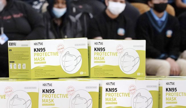 Boxes of KN95 protective masks are stacked together before being distributed to students at Camden High School in Camden, N.J., Wednesday, Feb. 9, 2022. A federal appeals court shot down claims that New Jersey residents&#x27; refusal to wear face masks during the COVID-19 outbreak at school board meetings constituted protected speech under the First Amendment. The 3rd Circuit Court of Appeals issued a ruling Monday, Feb. 5, 2024, in two related cases stemming from lawsuits against officials in Freehold and Cranford, N.J. (AP Photo/Matt Rourke, File)