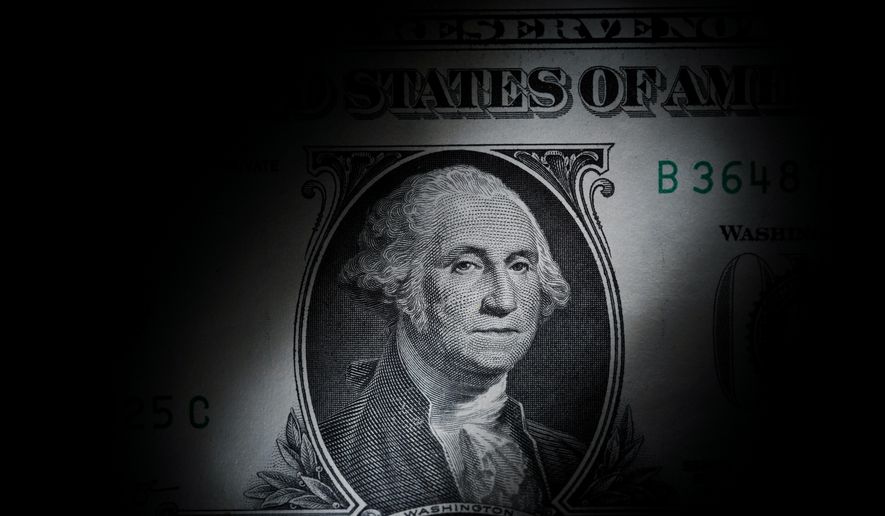 The likeness of George Washington is seen on a U.S. one-dollar bill, March 13, 2023, in Marple Township, Pa. (AP Photo/Matt Slocum, File)