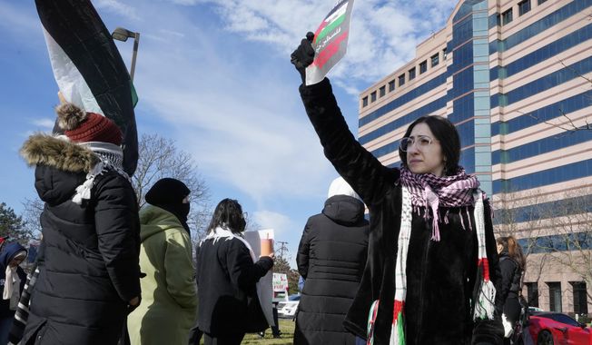 About three dozen people protesting Israel&#x27;s attacks in Gaza gather, Thursday, Feb. 8, 2024 in Dearborn, Mich. The protesters gathered hoping to be heard by members of the Biden White House who were scheduled to meet in suburban Detroit with Muslim and Arab American leaders. (AP Photo/Carlos Osorio)