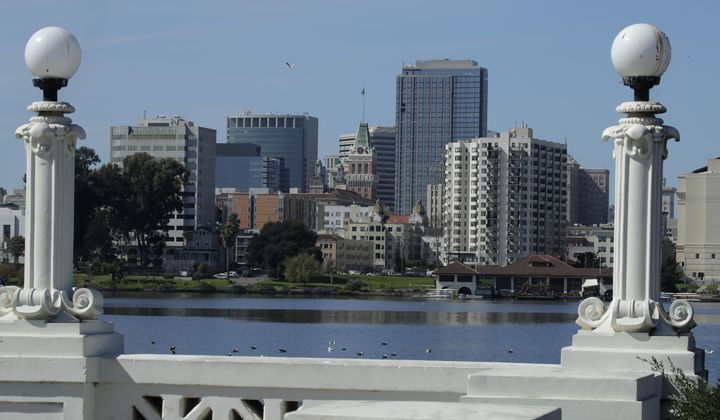 The Oakland skyline is seen from Lake Merritt on March 4, 2020, in Oakland, Calif. California Gov. Gavin Newsom said Thursday, Feb. 8, 2024, he is sending prosecutors to Oakland to help crackdown on rising crime in the San Francisco Bay Area city where brazen, broad daylight robberies have been getting national attention. (AP Photo/Ben Margot, File)