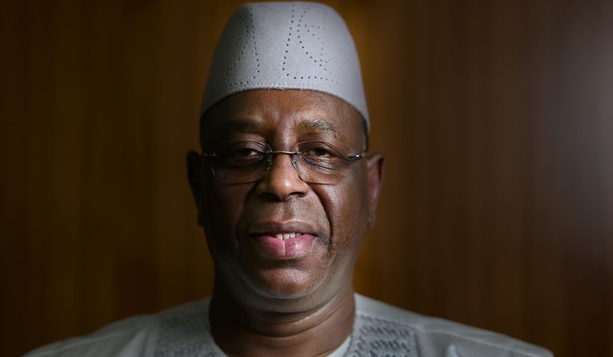 Senegal President Macky Sall poses during an interview with The Associated Press at the presidential palace in Dakar, Senegal, Friday, Feb. 9, 2024. (AP Photo/Sylvain Cherkaoui)