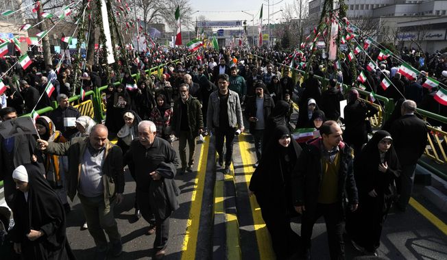 Iranians attend the annual rally commemorating the 1979 Islamic Revolution at the Azadi (Freedom) St. in Tehran, Iran, Sunday, Feb. 11, 2024. Iran marked Sunday the 45th anniversary of the 1979 Islamic Revolution amid tensions gripping the wider Middle East over Israel&#x27;s continued war on Hamas in the Gaza Strip. (AP Photo/Vahid Salemi)