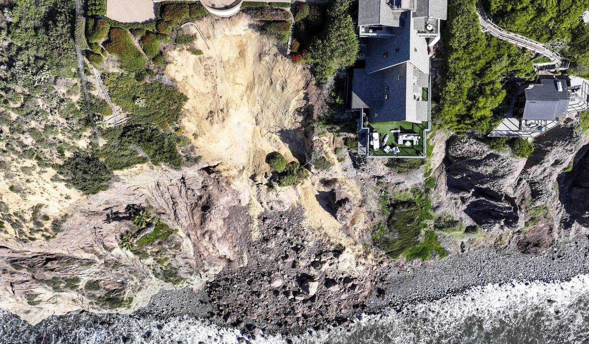 NextImg:Massive landslide on coastal bluff leaves Southern California mansion on the edge of a cliff