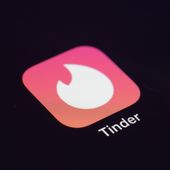 The icon for the dating app Tinder appears on a device, July 28, 2020, in New York. Tinder, Hinge and other dating apps are designed with addictive features that encourage “compulsive” use, a proposed class action lawsuit against parent company Match Group claims. The lawsuit filed Wednesday, Feb. 14, 2024, says Match intentionally designs its dating platforms with game-like features that “lock users into a perpetual pay-to-play loop” prioritizing profit over promises to help users find relationships. (AP Photo/Patrick Sison, File)