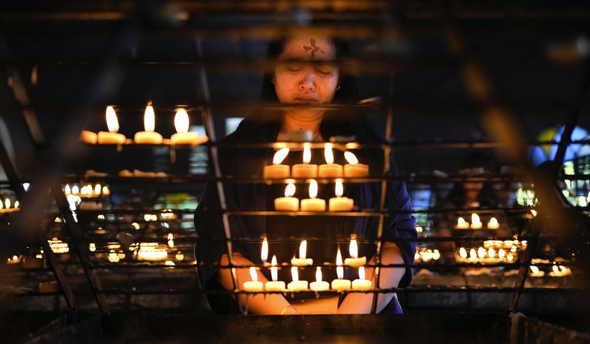 NextImg:Catholics in the Philippines have their foreheads marked with ash during Ash Wednesday