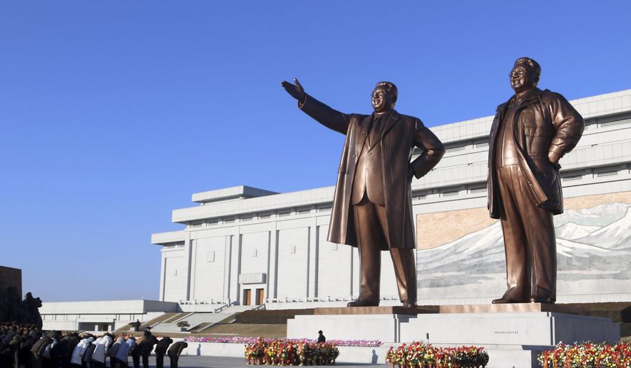 People of Pyongyang visit the statues of former North Korean leaders Kim Il Sung and Kim Jong Il on Mansu Hill on the occasion of 82nd birth anniversary of Kim Jong Il in Pyongyang, North Korea, Friday, Feb. 16, 2024. (AP Photo/Cha Song Ho)