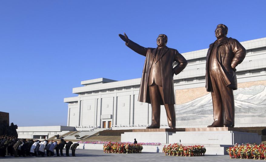 People of Pyongyang visit the statues of former North Korean leaders Kim Il Sung and Kim Jong Il on Mansu Hill on the occasion of 82nd birth anniversary of Kim Jong Il in Pyongyang, North Korea, Friday, Feb. 16, 2024. (AP Photo/Cha Song Ho)
