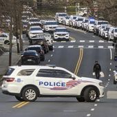 Washington, D.C., Metropolitan Police are shown near a scene where three police officers were shot and a fourth suffered minor injuries while responding to a shooting, Wednesday morning, Feb. 14, 2024, in Washington. (AP Photos/Nathan Ellgren) ** FILE **