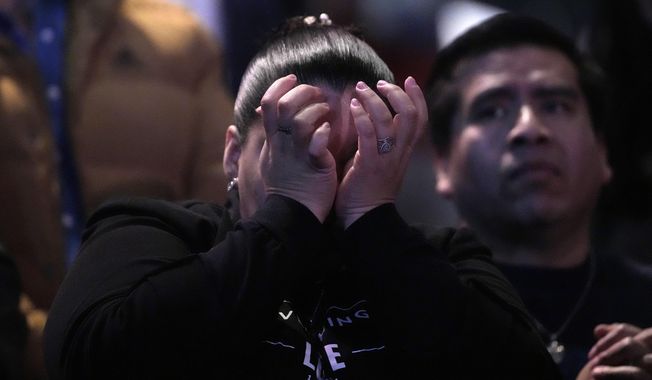 A churchgoer wipes away tears during a service at Lakewood Church Sunday, Feb. 18, 2024, in Houston. Pastor Joel Osteen on Sunday welcomed worshippers back to Lakewood Church for the first time since a woman with an AR-style opened fire in between services at his Texas megachurch last Sunday. (AP Photo/David J. Phillip)