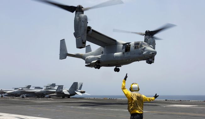In this image provided by the U.S. Navy, Aviation Boatswain&#x27;s Mate 2nd Class Nicholas Hawkins, signals an MV-22 Osprey to land on the flight deck of the USS Abraham Lincoln in the Arabian Sea on May 17, 2019. Air Force Special Operations Command said Tuesday it knows what failed on its CV-22B Osprey leading to a November crash in Japan that killed eight service members. But it still does not know why the failure happened. Because of the crash almost the entire Osprey fleet, hundreds of aircraft across the Air Force, Marine Corps and Navy, has been grounded since Dec. 6. (Mass Communication Specialist 3rd Class Amber Smalley/U.S. Navy via AP, File)