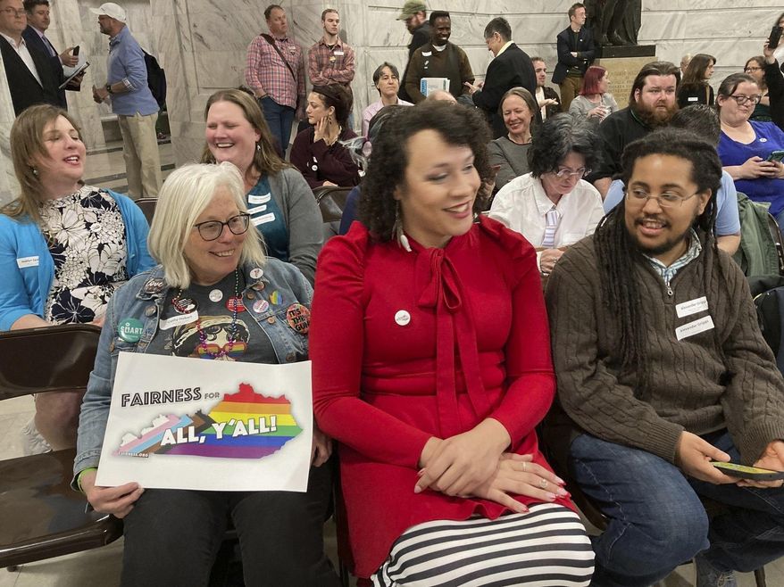 Gay-rights supporters attend a rally at the Kentucky Capitol on Wednesday, Feb. 21, 2024, in Frankfort, Ky. The rally came on the same day that Kentucky lawmakers advanced a bill that gay-rights advocates say would undermine local fairness ordinances protecting LGBTQ people against discrimination. (AP Photo/Bruce Schreiner)