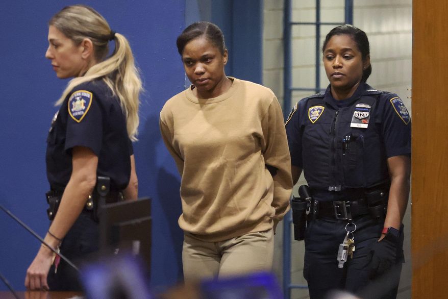 Jessica Beauvais enters the courtroom for her sentencing at the Queens Criminal Court on Wednesday, Feb. 21, 2024 in New York. Beauvais who struck and killed a New York City police detective after speeding through an NYPD roadblock while driving drunk was sentenced Wednesday to more than 20 years in prison. (Olivia Falcigno/Newsday via AP)